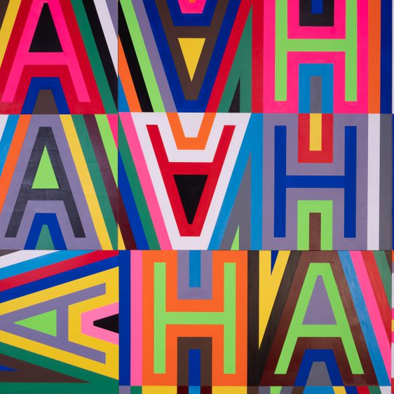 A close up of a brightly coloured graphic letters which spell out the words HAHA in a repeating pattern.