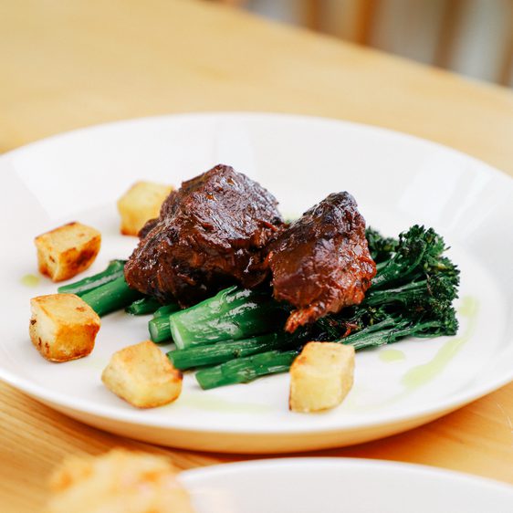 A plate of steak and seasonal vegetables.