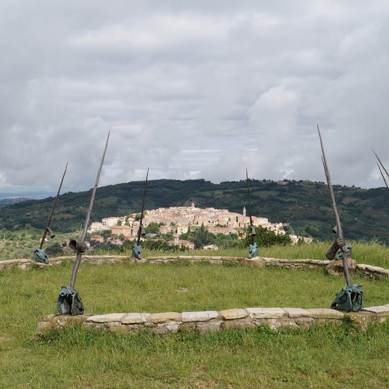 A circular wall with tall poles.