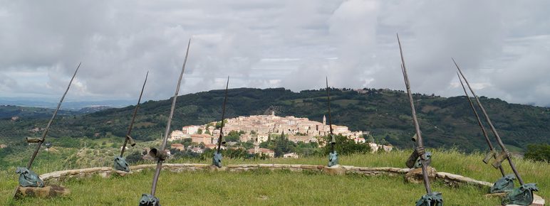 A circular wall with tall poles.