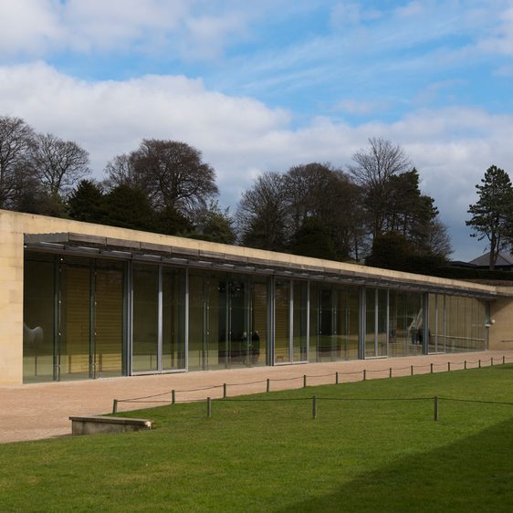 A low building with large windows along the front of it.
