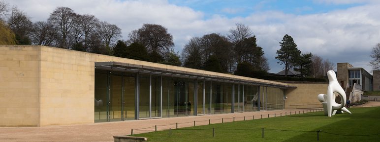 A low building with large windows along the front of it.