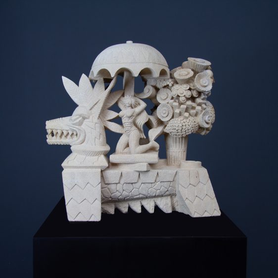 A stone sculputure of a wolf-like creature with a human figure under an umbrella on it's back.