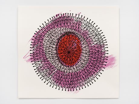 A colourful print made up of bindis in a circular pattern.