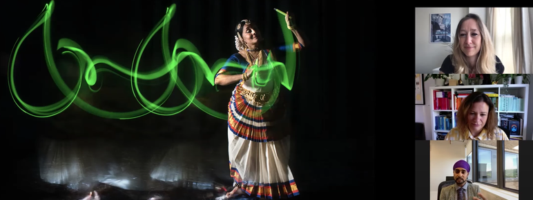 Three adults in an online zoom meeting, watching at a woman dancing on the screen.