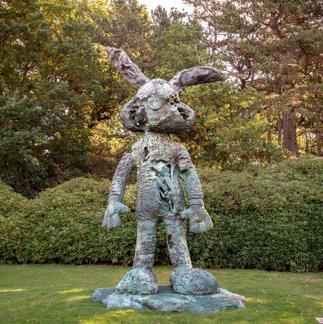 A sculpture of a giant Bugs Bunny shaped soft toy, with eroded crystal sections.