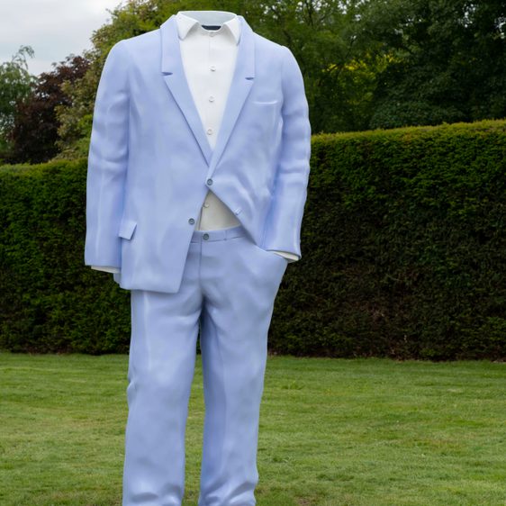 Sculpture of a headless person dressed in a purple suit and white shirt stood on grass.