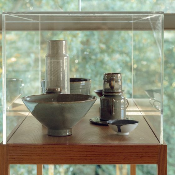 Cabinet of ceramic vessels including bowls and vases