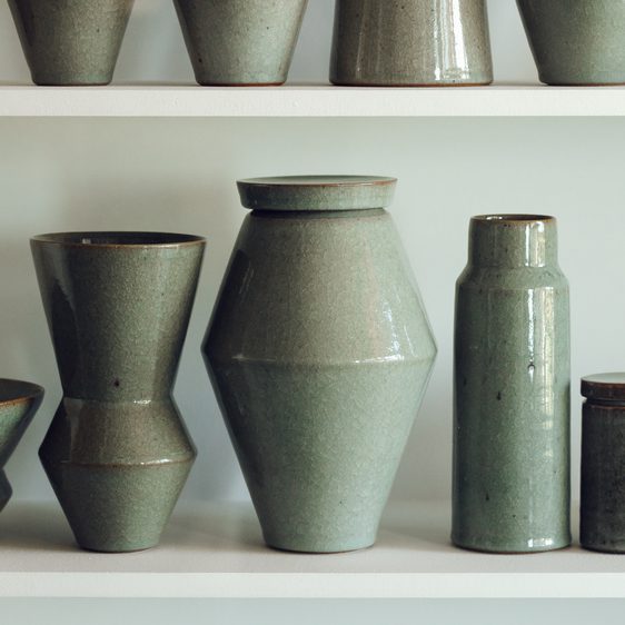 A selection of ceramic vessels on a shelf