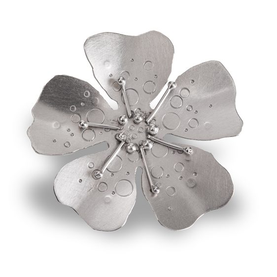A silver flower broach.