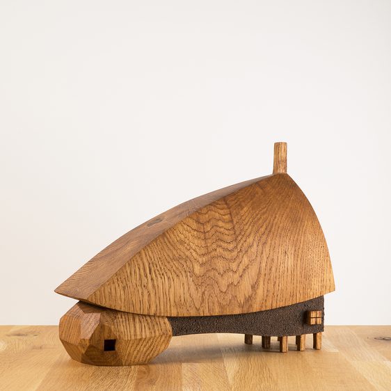 A carved small wooden house