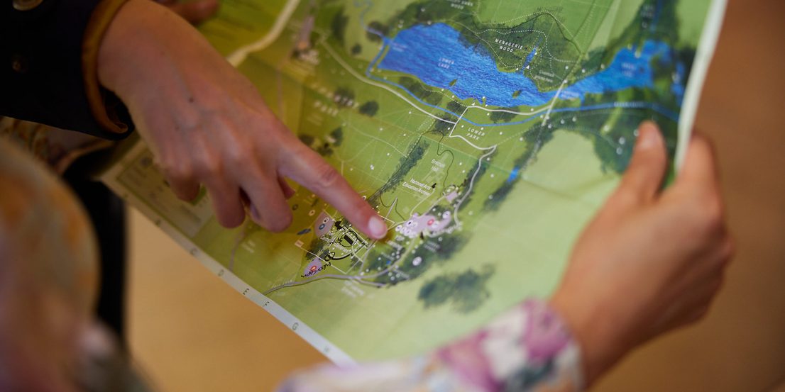 Close up of hands pointing to areas on a YSP Park map