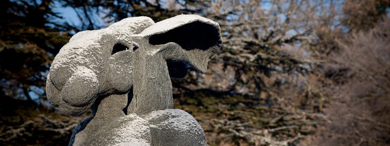 A sculpture with a woman's body and a rabbit head