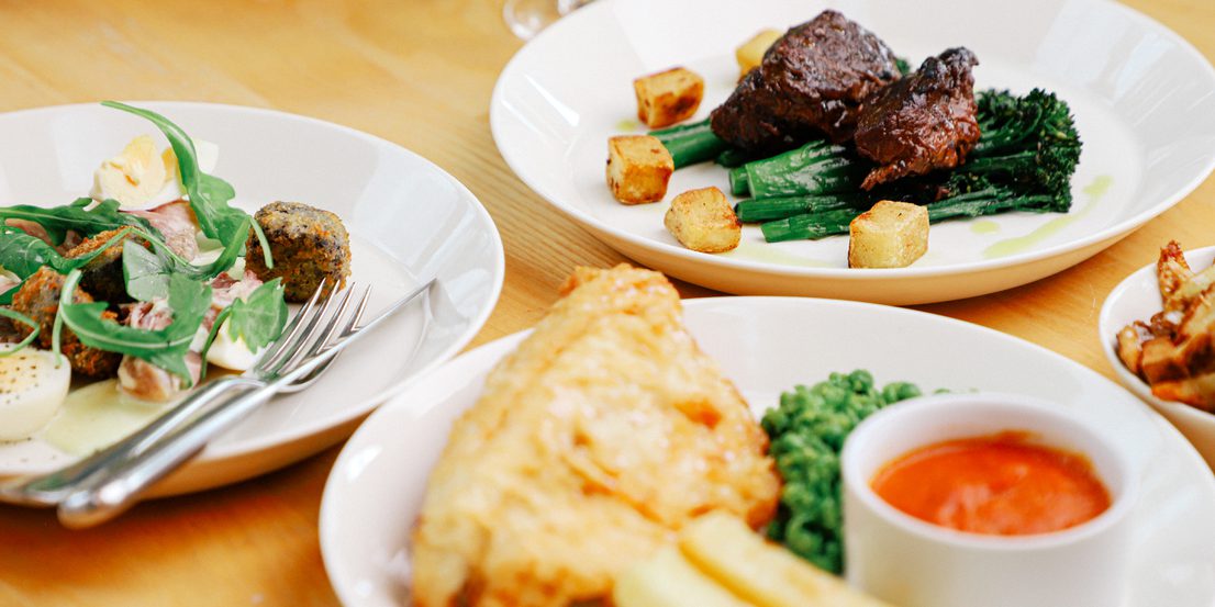 A table with plates of food.